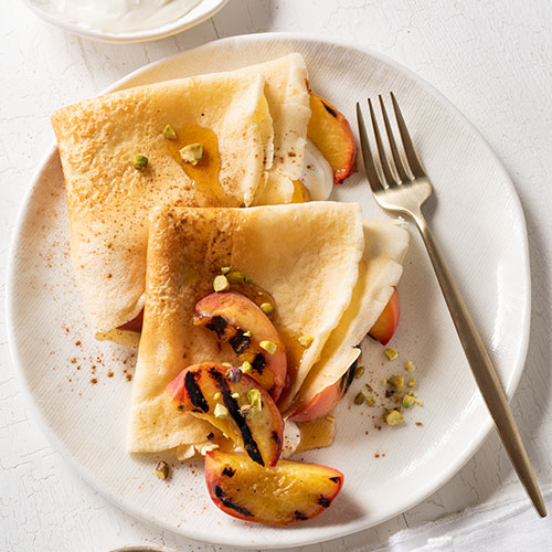 Crêpes with chargrilled peaches