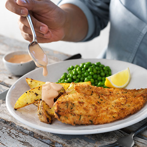 Homemade crumbed fish with hand-cut wedges