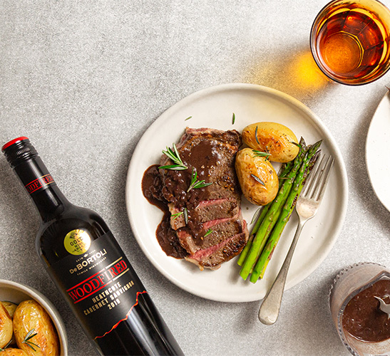 Charred steak with red wine jus