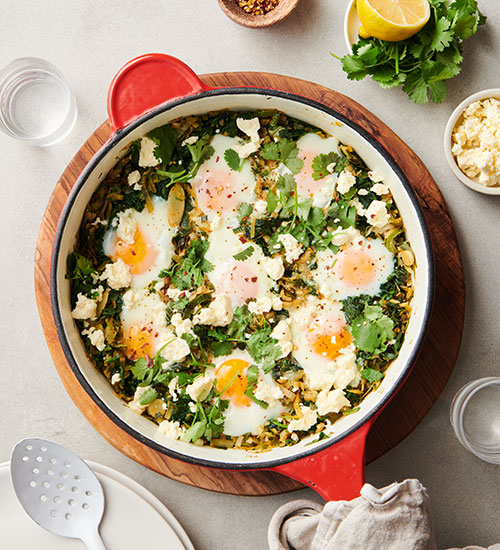 Green shakshuka-style baked eggs