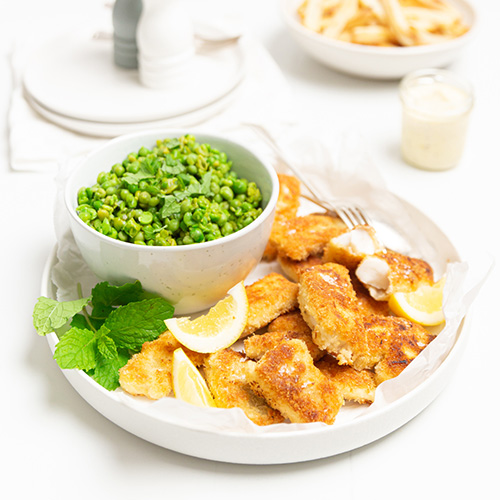Panko crumbed fish bites with smashed peas New World