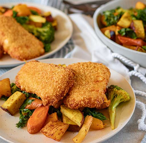 Crumbed fish with vegetables