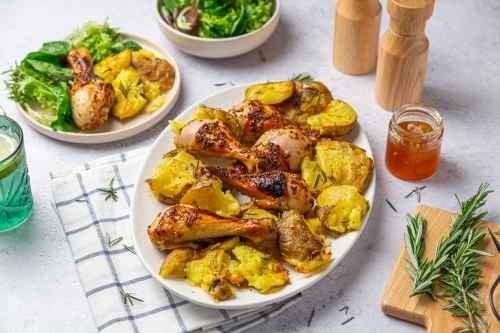 Baked honey mustard chicken drumsticks and smashed potatoes
